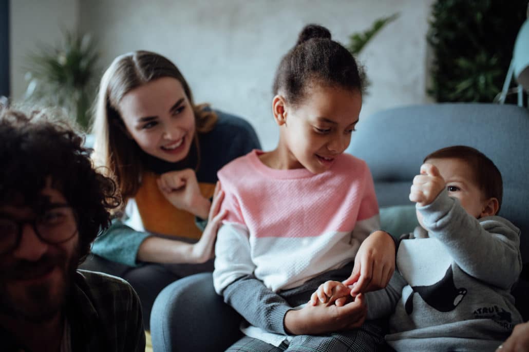 foster parents with foster chldren and biological children